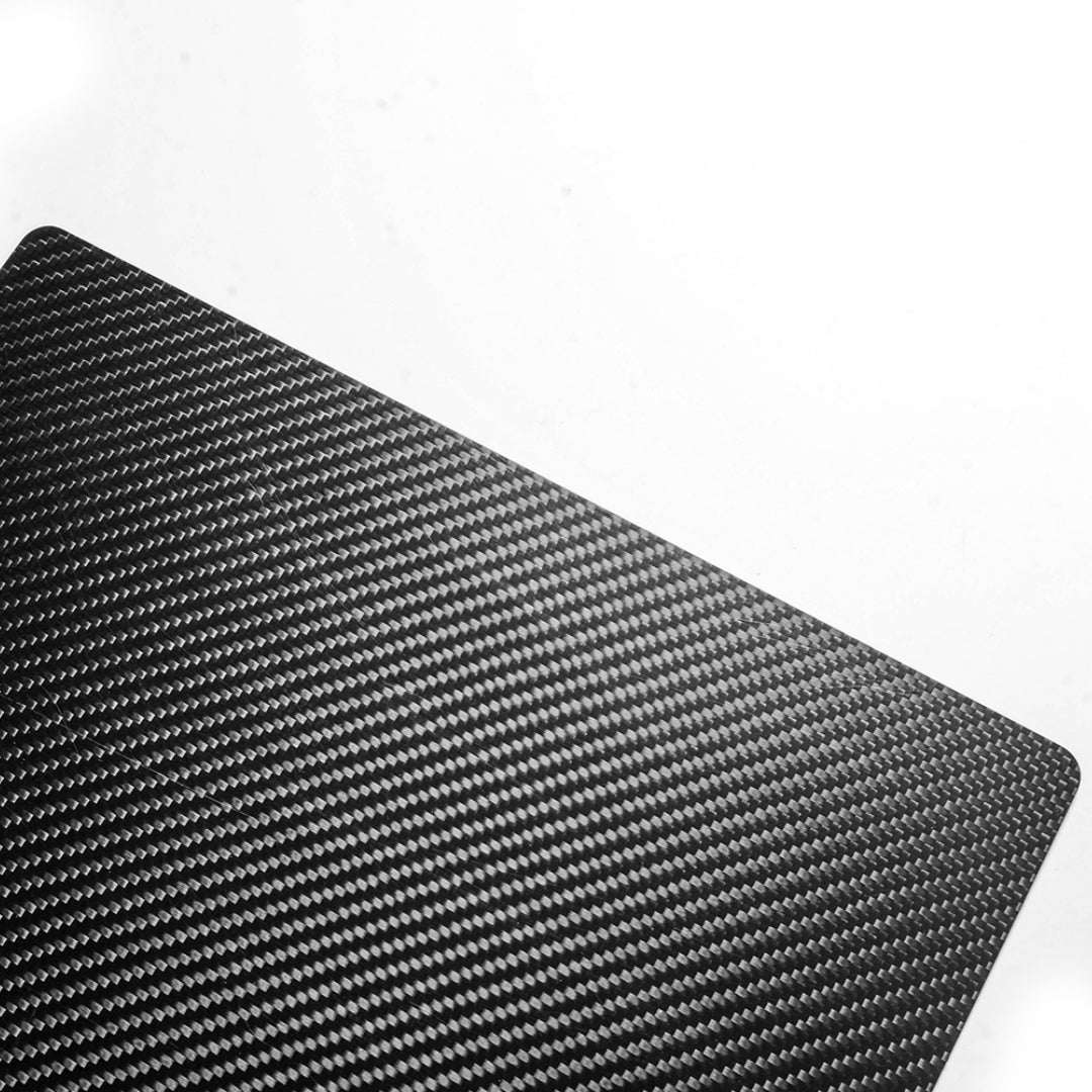 Close-up detail of a 3K carbon fiber clipboard showcasing its distinctive woven pattern against a white background.