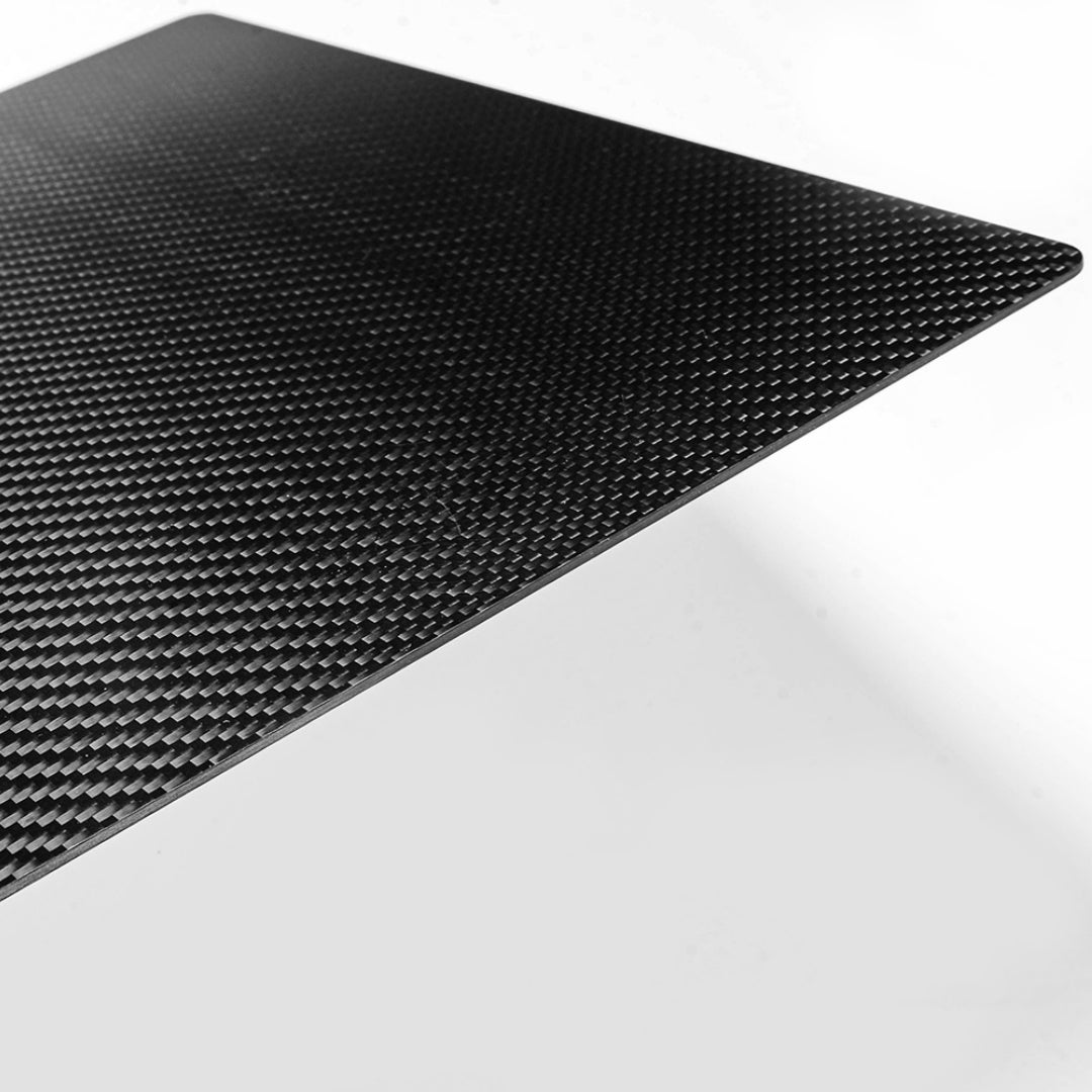 Close-up angled detail of a 3K carbon fiber clipboard, showcasing its signature woven pattern and sleek, smooth finish against a clean white background.