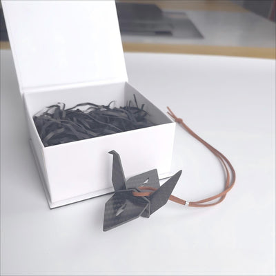 Carbon Fiber Paper Crane Car Pendant product image with carbon fiber finish