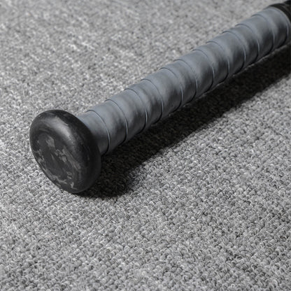 Close-up of the handle and end cap of a forged carbon fiber baseball bat, featuring a gray textured grip and a black end cap with subtle patterns, placed on a gray textured fabric surface.