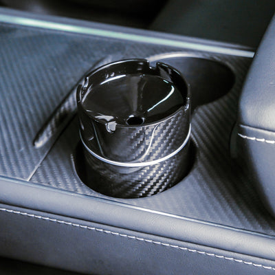 Close-up detail of a 3K carbon fiber car ashtray with a woven pattern
