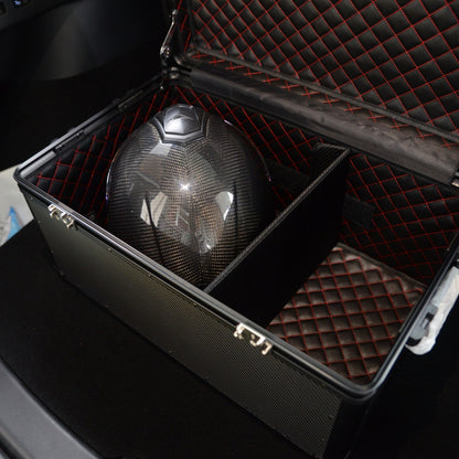 Close-up of an open 3K carbon fiber large car storage trunk with a quilted interior featuring red stitching, containing a carbon fiber helmet, placed in a car.