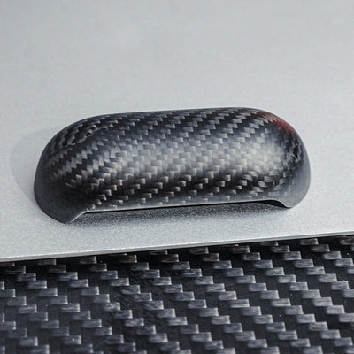 Close-up of the top cover of a 3K carbon fiber AirPods case showcasing the distinct weave pattern