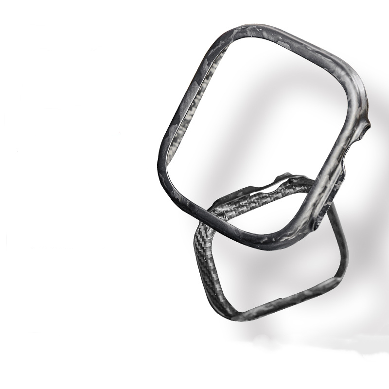 A close-up reveals an Apple Watch case crafted from 3K carbon fiber and forged carbon fiber, showcasing its distinctive woven texture in sharp detail.