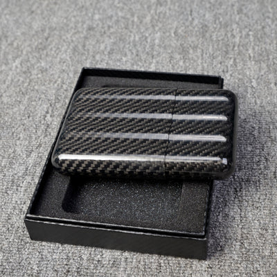 Close-up of a carbon fiber cigar case with a capacity for 4 cigars, featuring a distinct woven pattern
