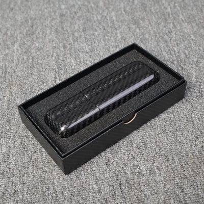 Close-up of a carbon fiber cigar case with a capacity for 2 cigars, featuring a distinct woven pattern