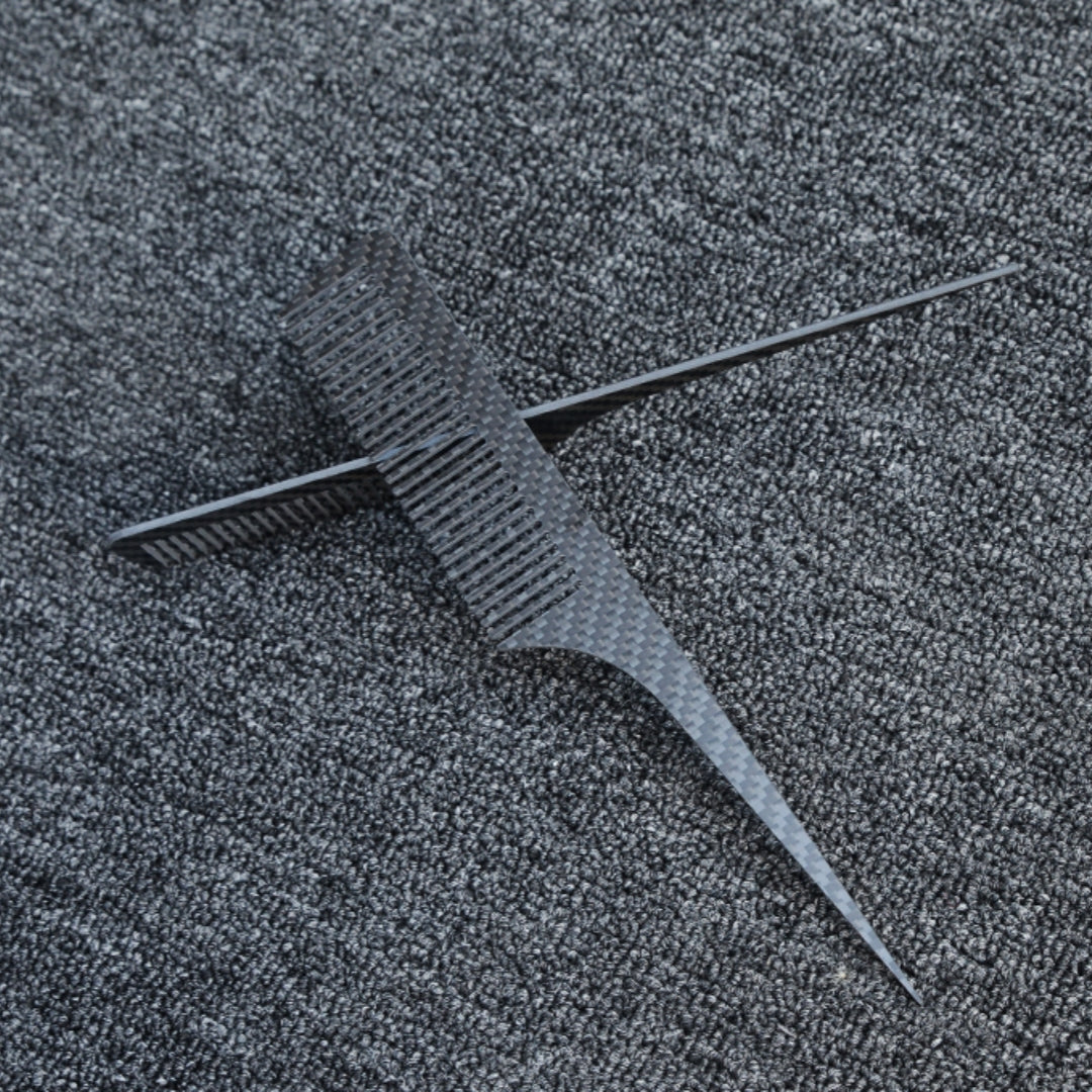 Close-up of carbon fiber combs with a distinct woven pattern, placed on a dark gray textured fabric surface.