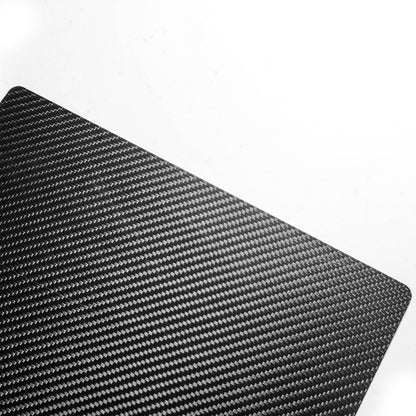 Close-up detail of a 3K carbon fiber clipboard showcasing its distinctive woven pattern against a white background.