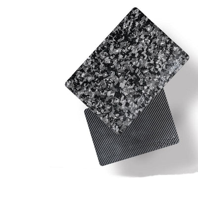 Close-up of forged carbon fiber and 3K carbon fiber mouse pads, featuring exceptionally clear surface textures.