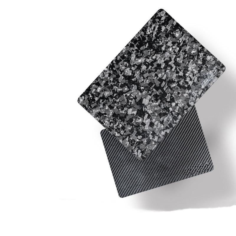 Close-up of forged carbon fiber and 3K carbon fiber mouse pads, featuring exceptionally clear surface textures.