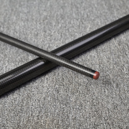 Two carbon fiber pool cue sections crossed over each other, featuring a textured carbon fiber finish with one section having a wooden tip, placed on a gray textured surface.